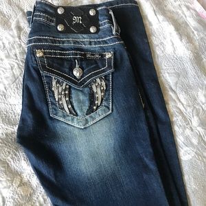 Miss Me Fallen Angel, boot cut, medium wash, blue jeans.